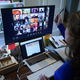 A lower school substitute teacher works from her home, helping other teachers build skills with new digital platforms, due to the coronavirus outbreak on April 1, 2020, in Arlington, Virginia.